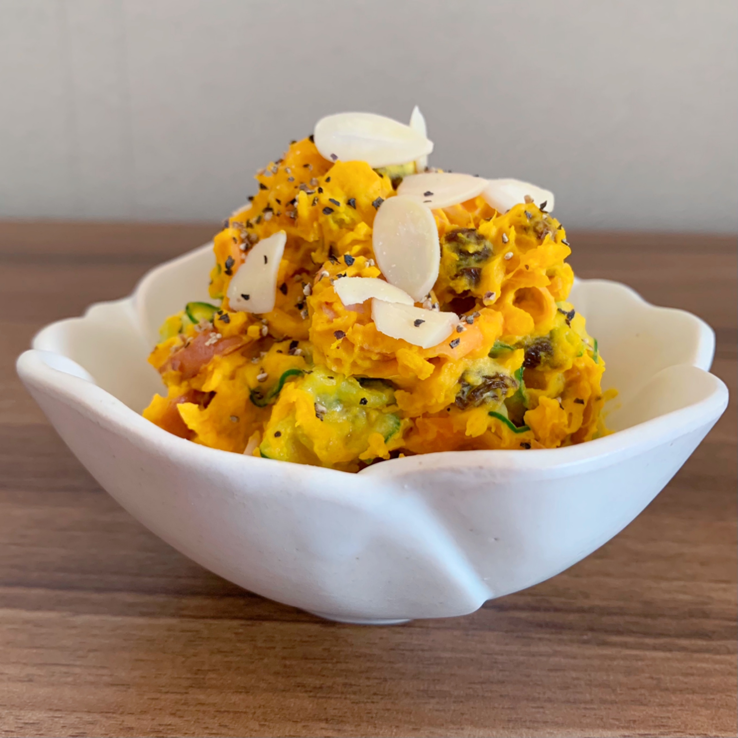 A salad made with pumpkin and mayonnaise that looks like a side dish from a department store.