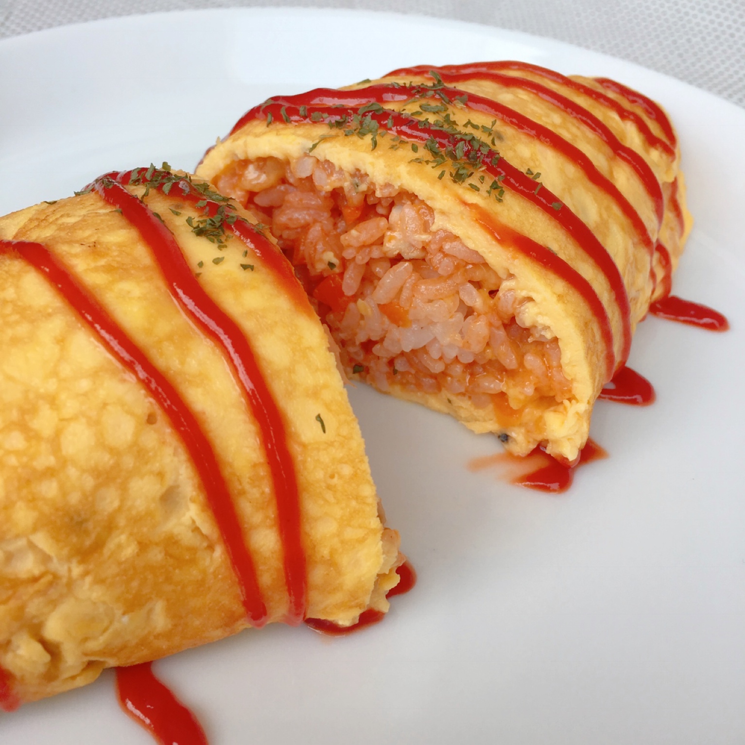It is a dish of rice seasoned with ketchup wrapped in an egg.