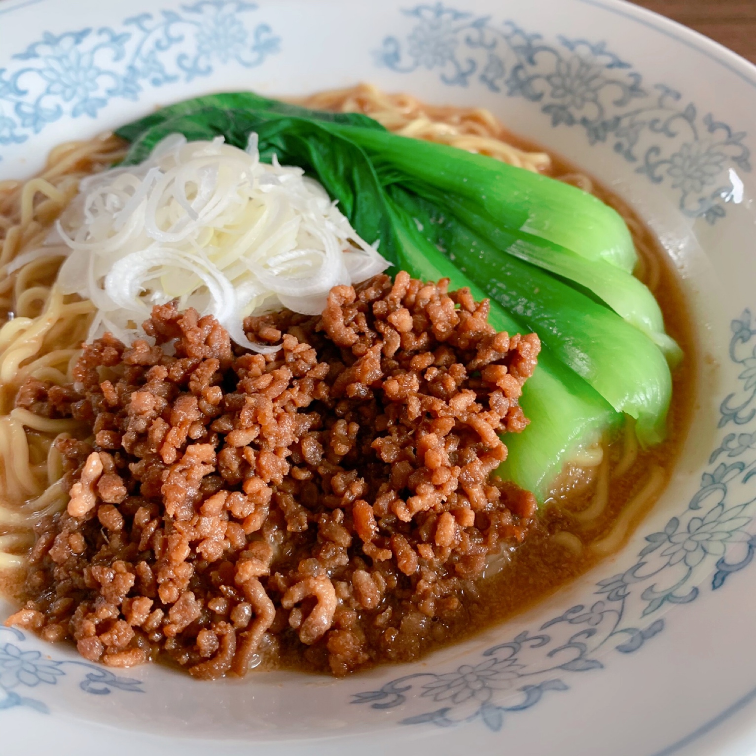 A delicious noodle dish with garlic and ginger flavored meat miso and rich sesame paste soup.