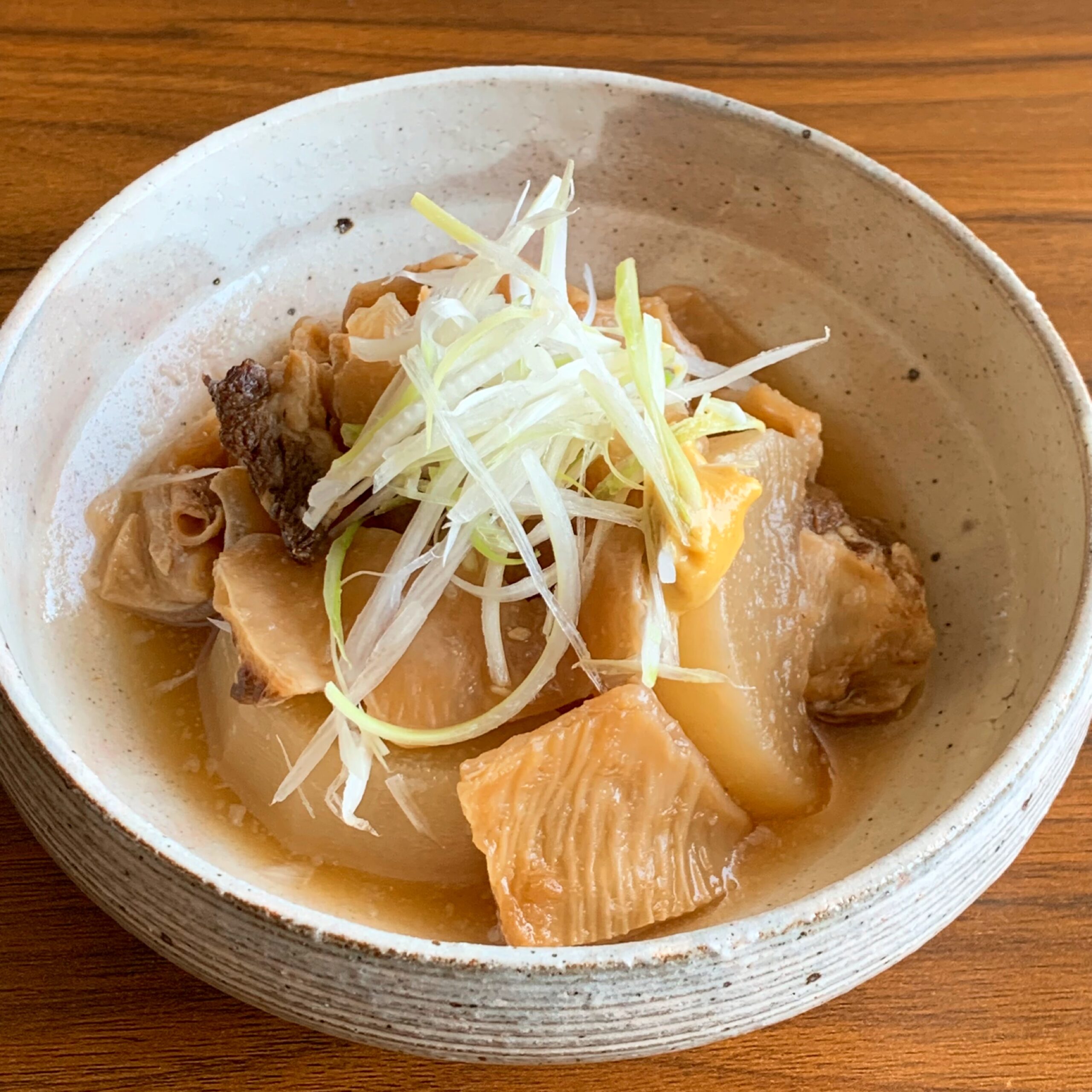 Stewed beef tendon and Japanese radish in a pressure cooker.