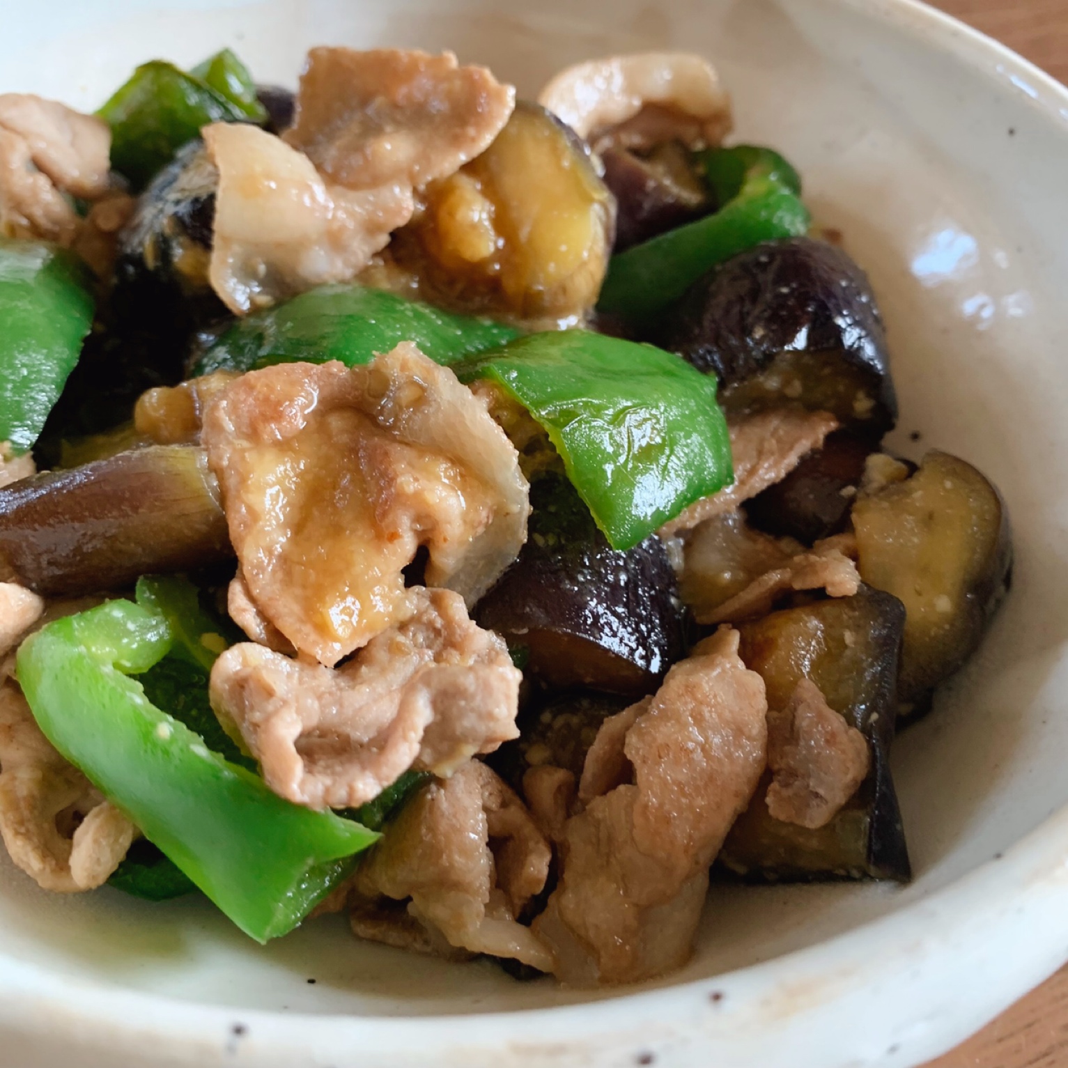 A stir-fried dish of pork, green pepper, and eggplant with miso.
