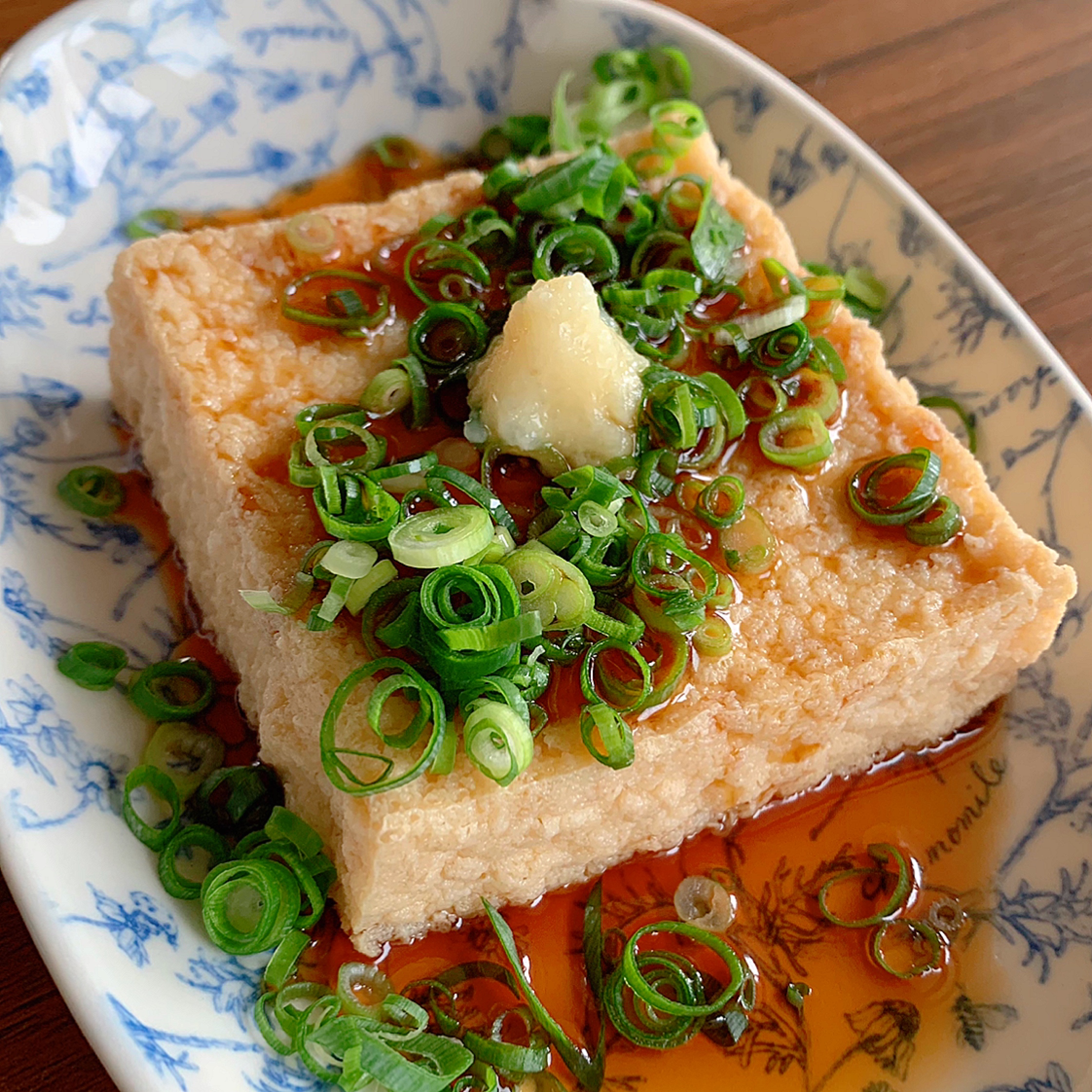 This dish is deep fried tofu (atsuage) heated in a microwave and topped with ginger and ponzu sauce.