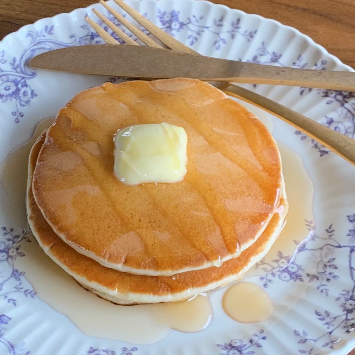 Pancakes made from pancake mix and topped with honey and butter.