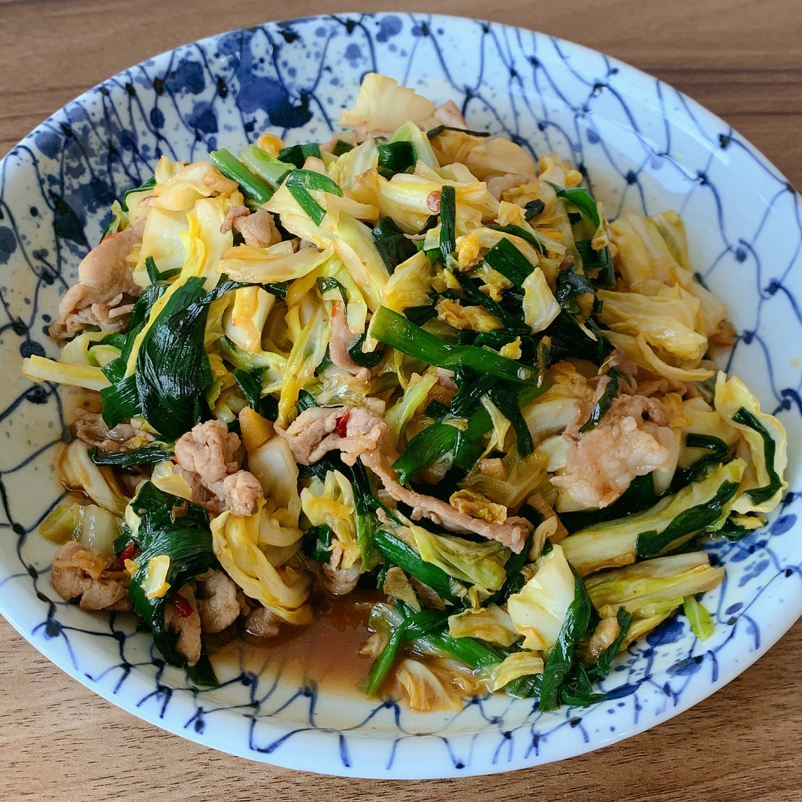 Chinese chives, cabbage, and pork are stir-fried and seasoned with oyster sauce. 