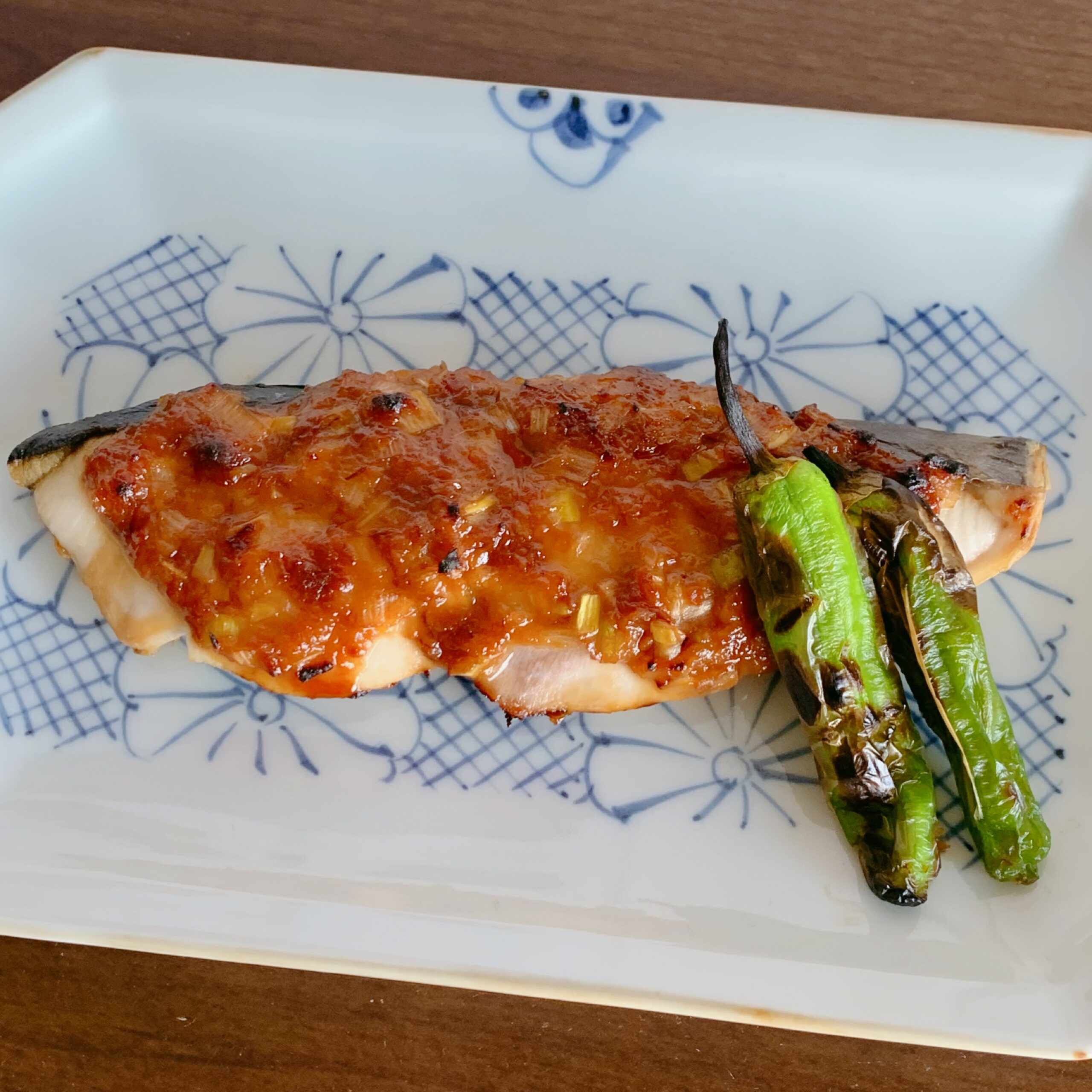 A sauce made with chopped Japanese leeks and  miso is placed on top of Spanish mackerel and  grilled