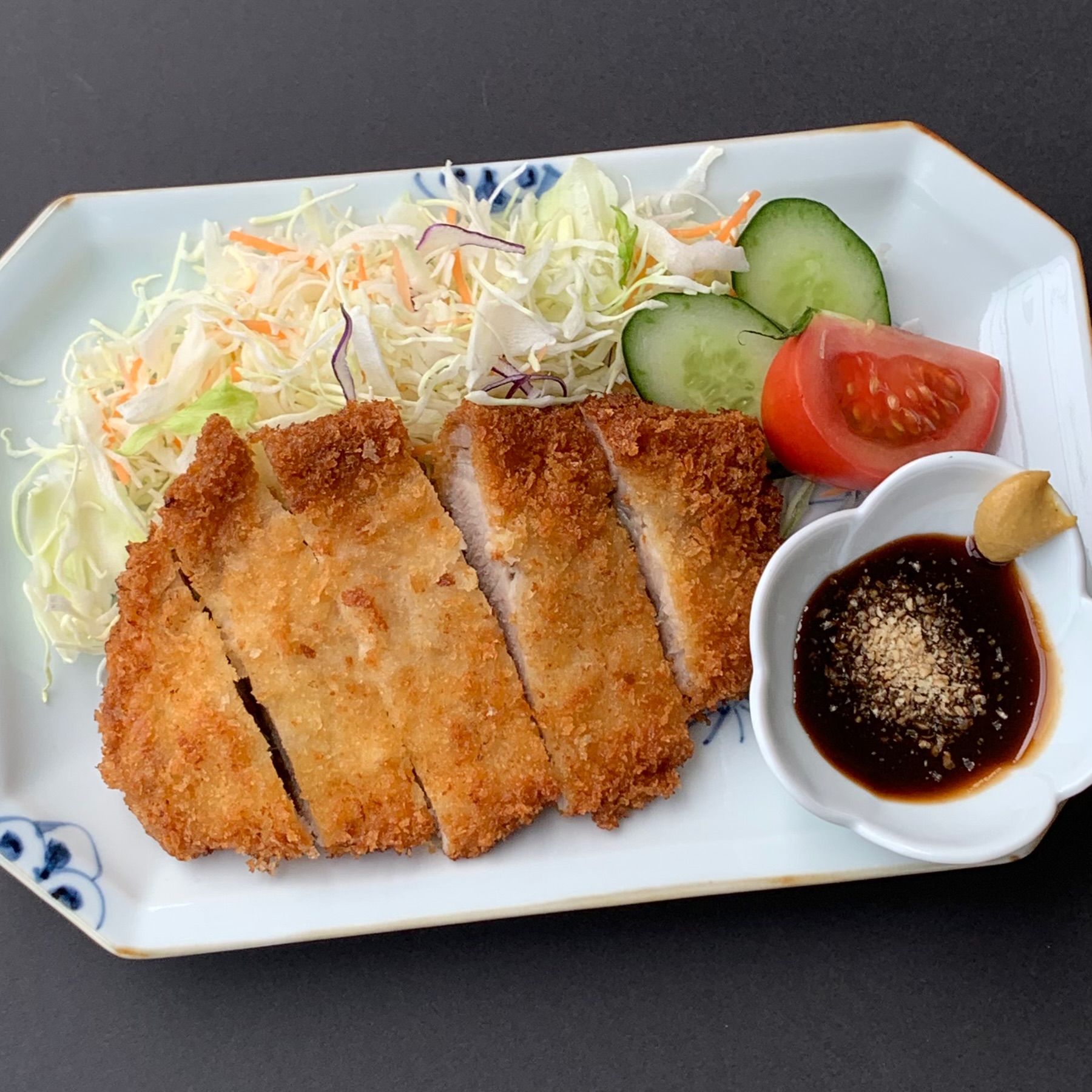 Tonkatsu is pork loin coated in flour, egg and breadcrumbs and then deep fried.