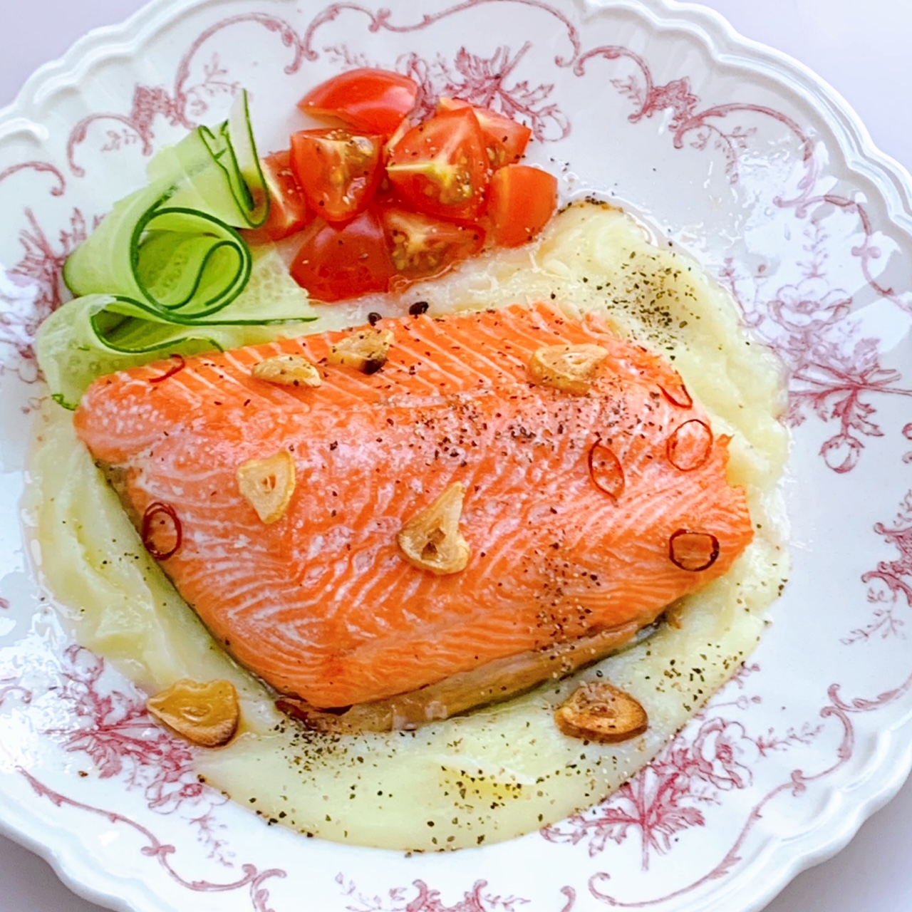 Marinate the salmon in olive oil and garlic and grill in the oven.