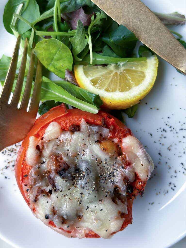 I hollowed out the tomatoes, stuffed them with chili con carne, and baked them in the oven.