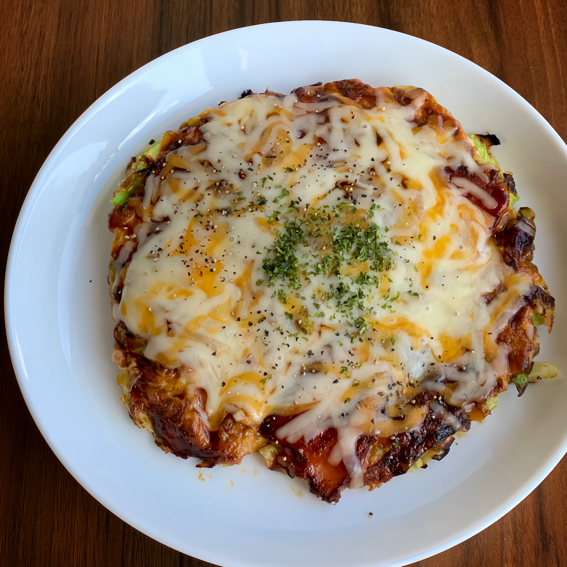 Okonomiyaki is a pancake made from shredded cabbage, eggs, and flour.